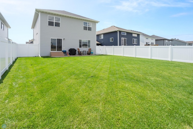 1030 Albert Dr W, West Fargo, ND 58078 - rear view of house featuring a fenced backyard, entry steps, and a patio area