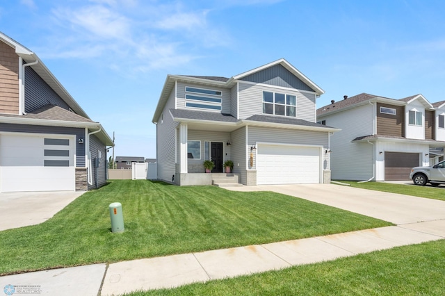 1030 Albert Dr W, West Fargo, ND 58078 - view of front of property featuring concrete driveway, an attached garage, and stone siding