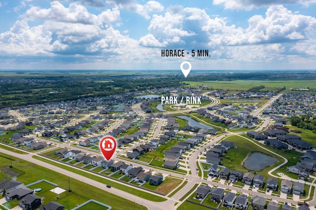 1030 Albert Dr W, West Fargo, ND 58078 - aerial perspective of suburban area with a large body of water