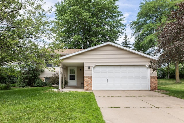 4019 Baffin Ln NE, Rochester, MN 55906 - view of front of property featuring brick siding, concrete driveway, an attached garage, and a front lawn