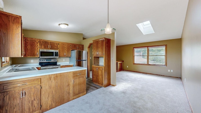 4019 Baffin Ln NE, Rochester, MN 55906 - kitchen with appliances with stainless steel finishes, a skylight, light carpet, light countertops, and lofted ceiling