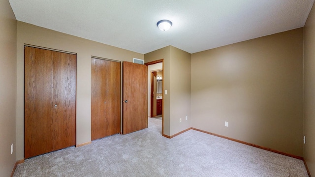 4019 Baffin Ln NE, Rochester, MN 55906 - unfurnished bedroom with two closets and carpet floors