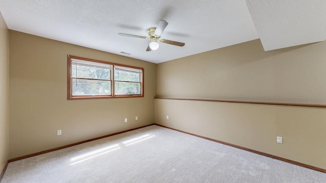 4019 Baffin Ln NE, Rochester, MN 55906 - empty room with carpet floors, a ceiling fan, and a textured ceiling