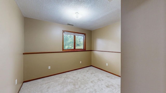 4019 Baffin Ln NE, Rochester, MN 55906 - carpeted spare room featuring a textured ceiling and baseboards