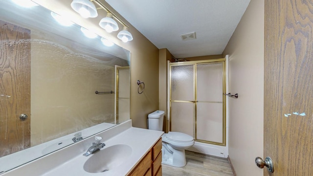 4019 Baffin Ln NE, Rochester, MN 55906 - full bathroom featuring a shower stall, vanity, and wood finished floors