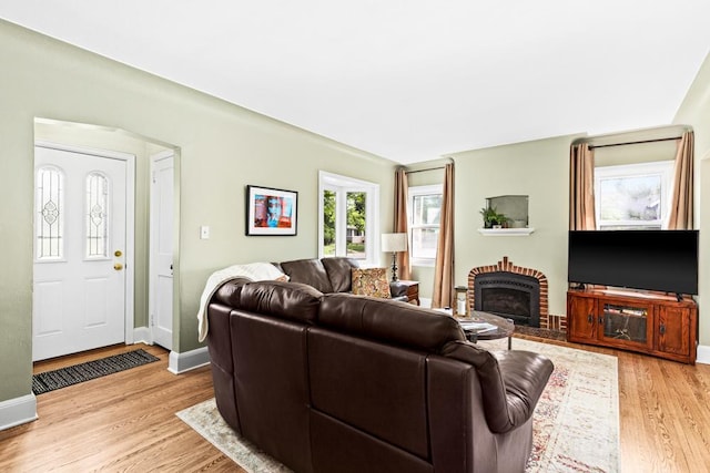 4332 Cooke St, Duluth, MN 55804 - living area with light wood finished floors and a brick fireplace