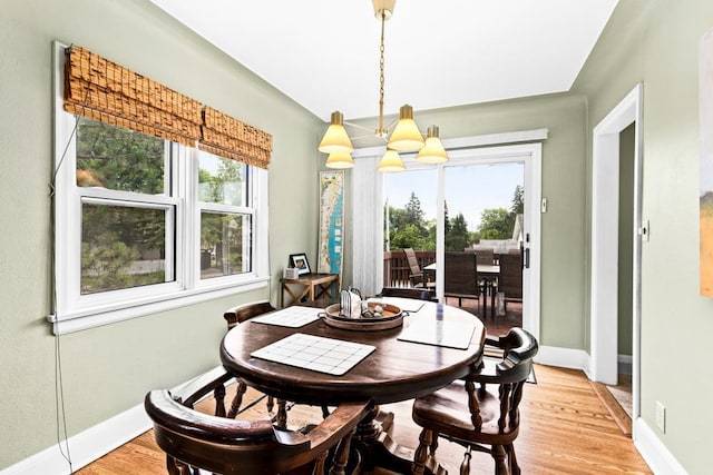 4332 Cooke St, Duluth, MN 55804 - dining space featuring healthy amount of natural light, a chandelier, and light wood-type flooring