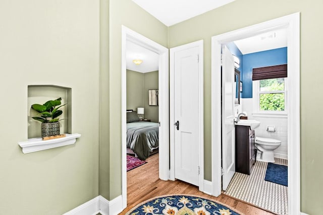 4332 Cooke St, Duluth, MN 55804 - corridor featuring wood finished floors and a sink