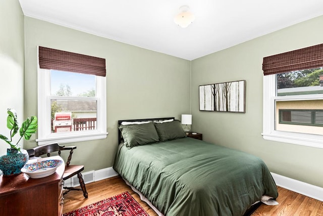 4332 Cooke St, Duluth, MN 55804 - bedroom with multiple windows and wood finished floors