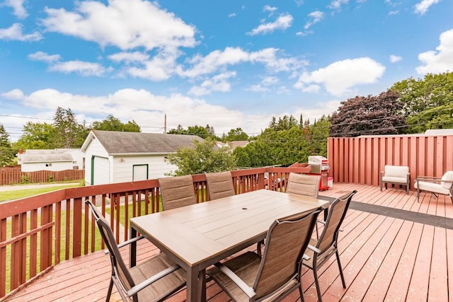 4332 Cooke St, Duluth, MN 55804 - wooden terrace featuring an outbuilding, outdoor dining area, and a garage