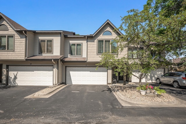 8 110th Ln NW, Coon Rapids, MN 55448 - multi unit property featuring driveway and an attached garage
