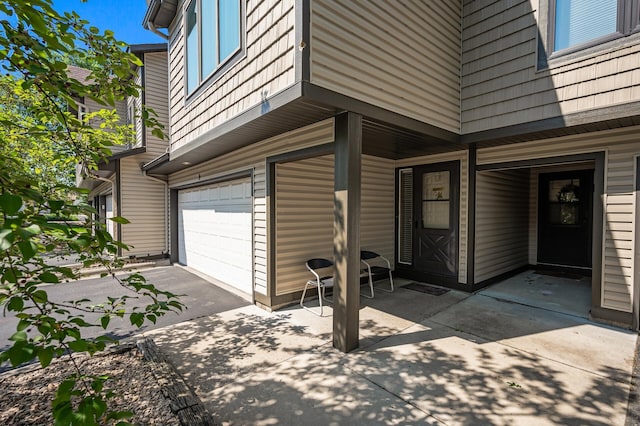 8 110th Ln NW, Coon Rapids, MN 55448 - property entrance featuring an attached garage and asphalt driveway