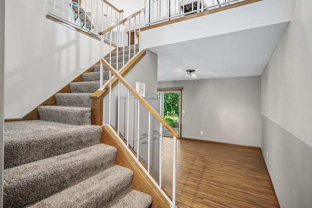 8 110th Ln NW, Coon Rapids, MN 55448 - stairs with wood finished floors and baseboards