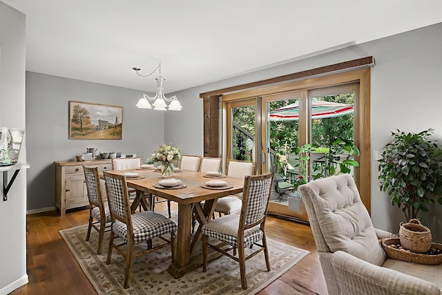 8 110th Ln NW, Coon Rapids, MN 55448 - dining room featuring light wood-style floors and a chandelier