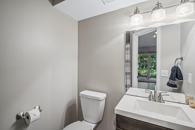 8 110th Ln NW, Coon Rapids, MN 55448 - bathroom with toilet and vanity
