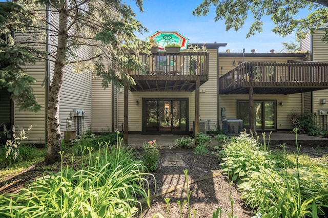 8 110th Ln NW, Coon Rapids, MN 55448 - back of property with a deck and french doors