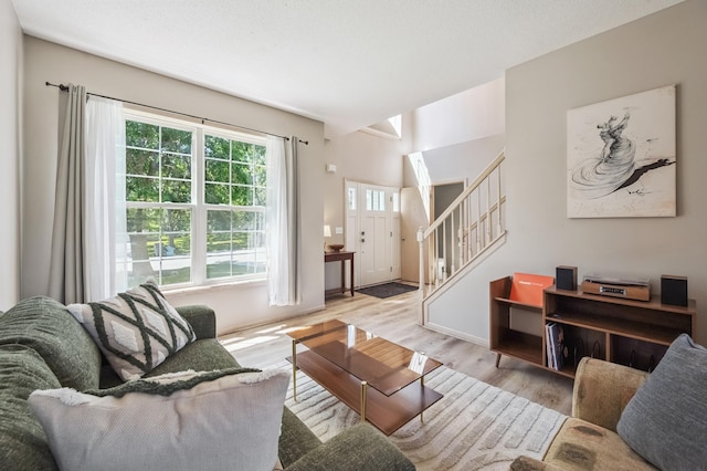2722 Autumn Woods Dr, Chaska, MN 55318 - living area with stairway, wood finished floors, and vaulted ceiling