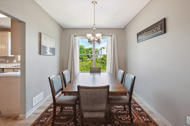 2722 Autumn Woods Dr, Chaska, MN 55318 - dining area with a chandelier and light wood-type flooring