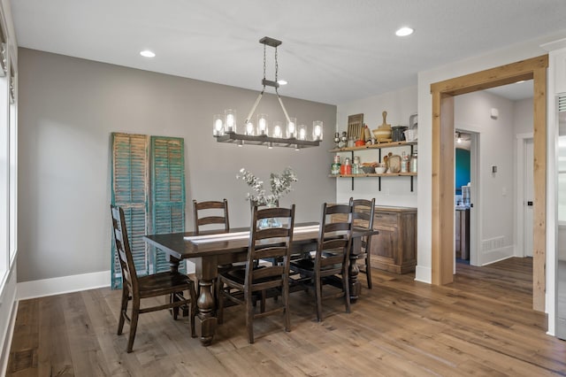 13430 Vickers St NE, Andover, MN 55304 - dining room featuring wood finished floors, a chandelier, and recessed lighting
