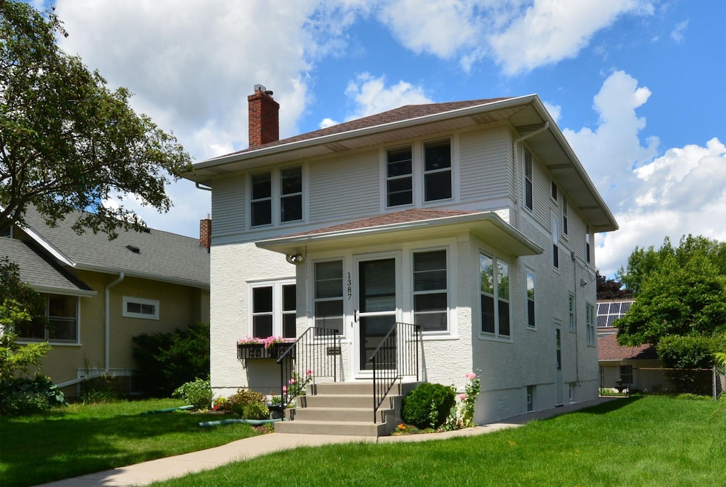 1387 Osceola Ave, Saint Paul, MN 55105 - traditional style home featuring a chimney and a front yard