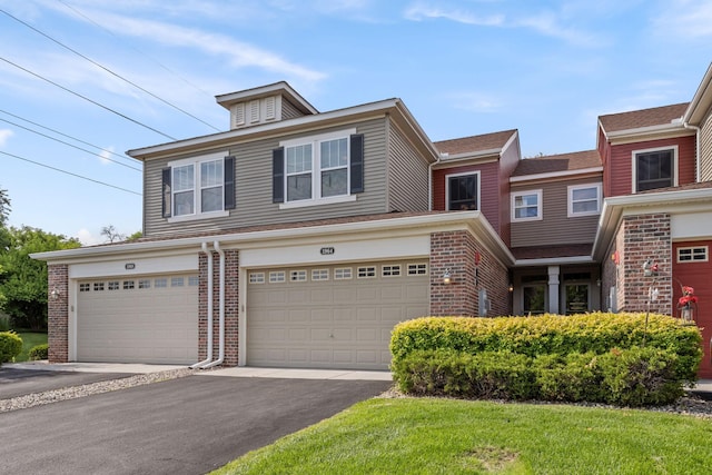 1964 Lincoln Ln, Chanhassen, MN 55317 - view of front of property with brick siding, driveway, and a garage