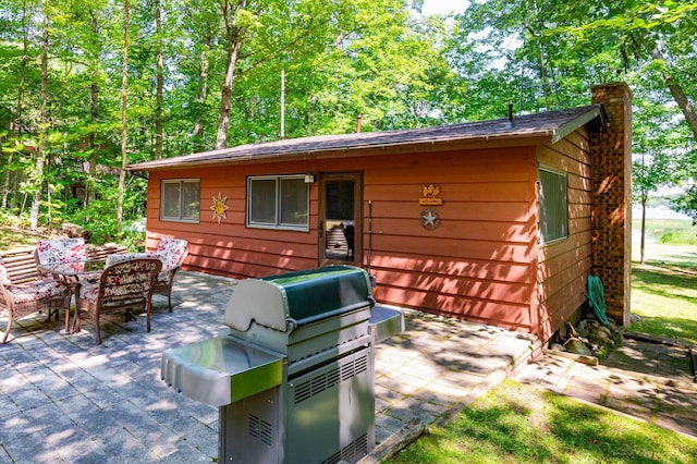 90162 Shady Oak Ln, Kerrick Twp, MN 55756 - view of patio featuring a grill and outdoor dining space