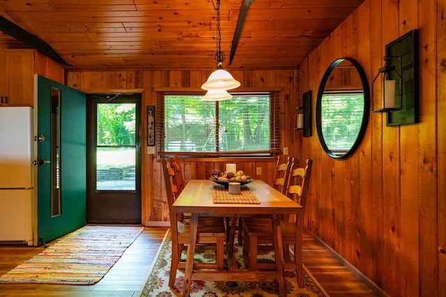 90162 Shady Oak Ln, Kerrick Twp, MN 55756 - dining area featuring wood walls, wood ceiling, hardwood / wood-style flooring, and vaulted ceiling
