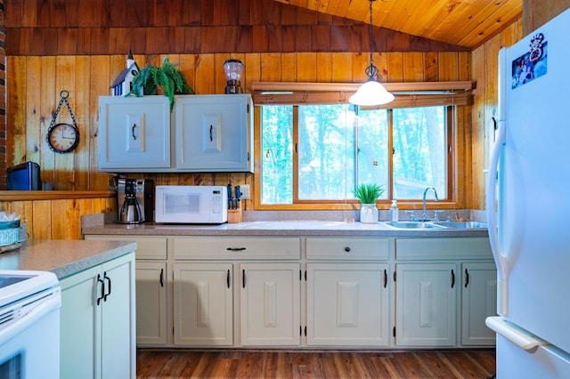 90162 Shady Oak Ln, Kerrick Twp, MN 55756 - kitchen with white appliances, lofted ceiling, wood walls, white cabinets, and light countertops