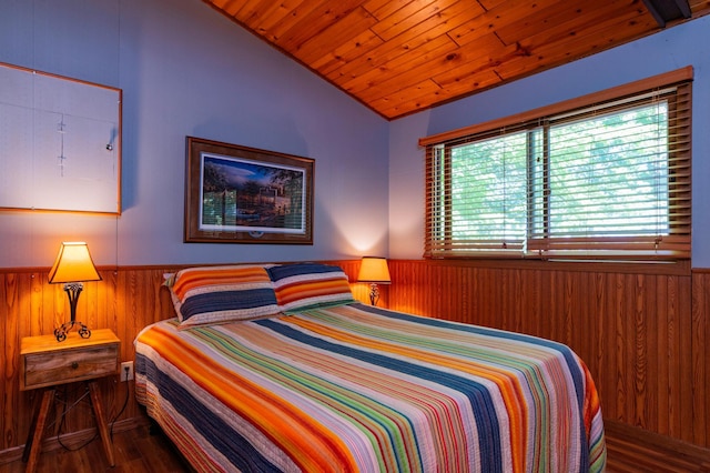 90162 Shady Oak Ln, Kerrick Twp, MN 55756 - bedroom with wainscoting, vaulted ceiling, wood walls, and wood finished floors