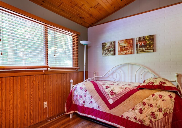 90162 Shady Oak Ln, Kerrick Twp, MN 55756 - bedroom featuring lofted ceiling, wood finished floors, wooden ceiling, wainscoting, and wood walls
