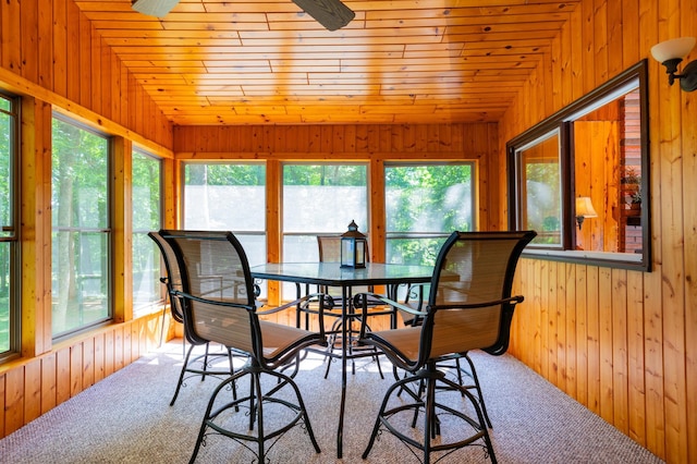 90162 Shady Oak Ln, Kerrick Twp, MN 55756 - carpeted dining room with healthy amount of natural light, wood walls, wooden ceiling, and vaulted ceiling