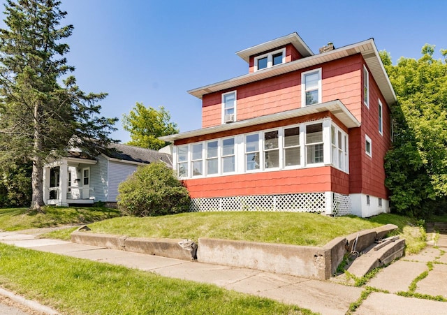 41 9th St, Cloquet, MN 55720 - traditional style home featuring a sunroom and a front lawn