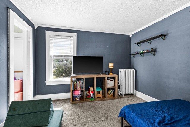 41 9th St, Cloquet, MN 55720 - bedroom featuring radiator heating unit, a textured ceiling, crown molding, and carpet flooring