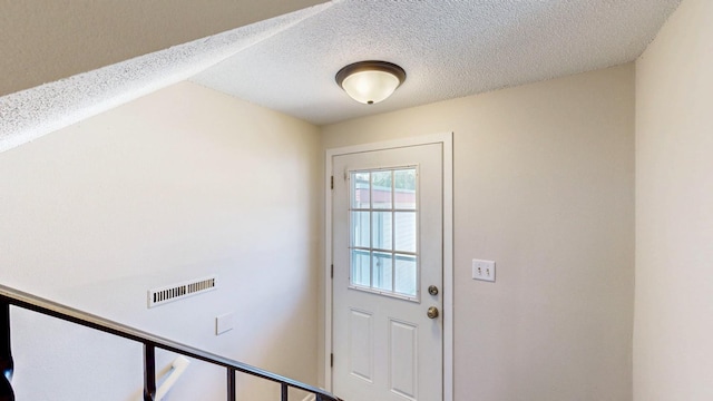 929 40th St NW, Rochester, MN 55901 - doorway with a textured ceiling