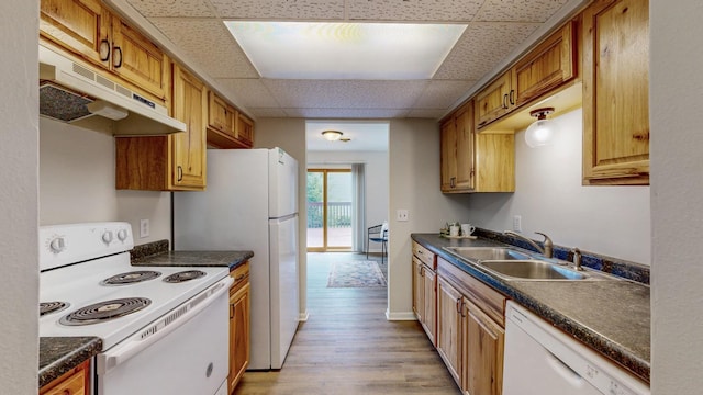 929 40th St NW, Rochester, MN 55901 - kitchen with white appliances, under cabinet range hood, dark countertops, light wood-type flooring, and a drop ceiling