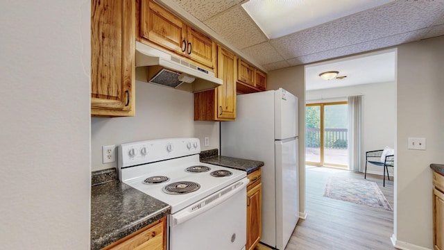 929 40th St NW, Rochester, MN 55901 - kitchen featuring white appliances, under cabinet range hood, light wood-style flooring, brown cabinetry, and a drop ceiling