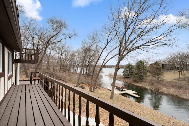 6485 46th Ave SE, Haven Twp, MN 56304 - wooden terrace with a water view and a dock