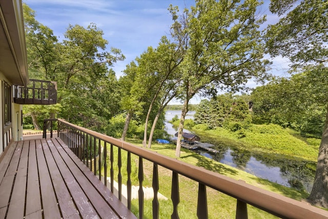 6485 46th Ave SE, Haven Twp, MN 56304 - deck with a water view and view of wooded area