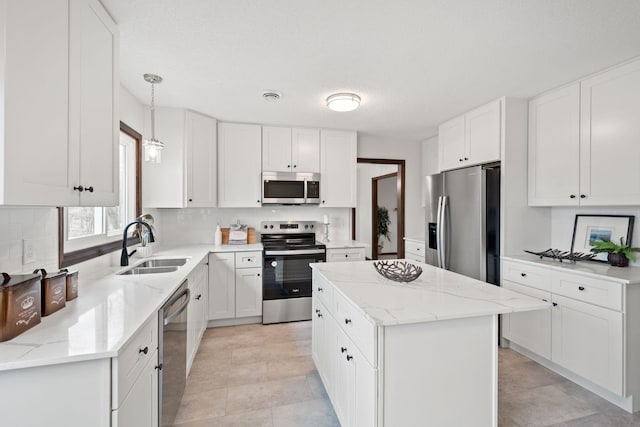 6485 46th Ave SE, Haven Twp, MN 56304 - kitchen featuring appliances with stainless steel finishes, backsplash, white cabinets, light stone countertops, and a textured ceiling