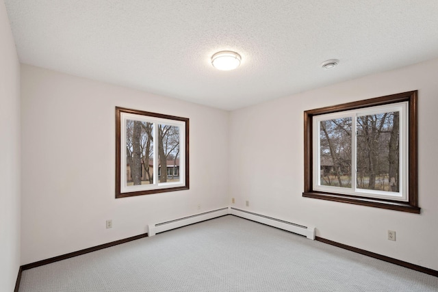 6485 46th Ave SE, Haven Twp, MN 56304 - unfurnished room with carpet, healthy amount of natural light, a textured ceiling, a smoke detector, and a baseboard radiator