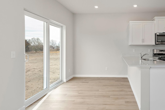 39746 Fallbrook Ave, North Branch, MN 55056 - unfurnished dining area with light wood-style floors and recessed lighting