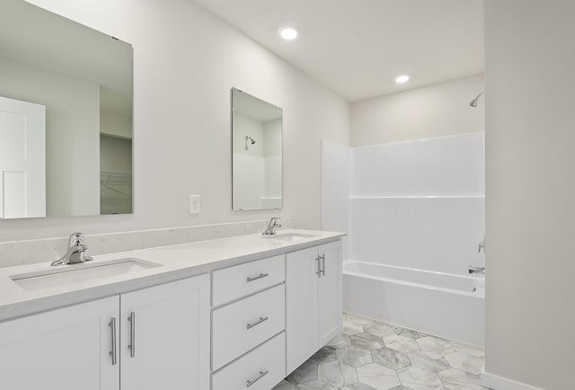 39746 Fallbrook Ave, North Branch, MN 55056 - bathroom with double vanity, shower / washtub combination, and recessed lighting