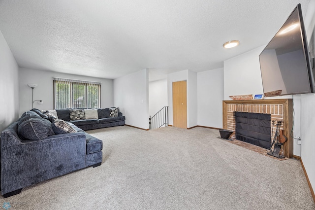 2350 20th Ave S, Fargo, ND 58103 - living area featuring a textured ceiling, carpet, and a brick fireplace