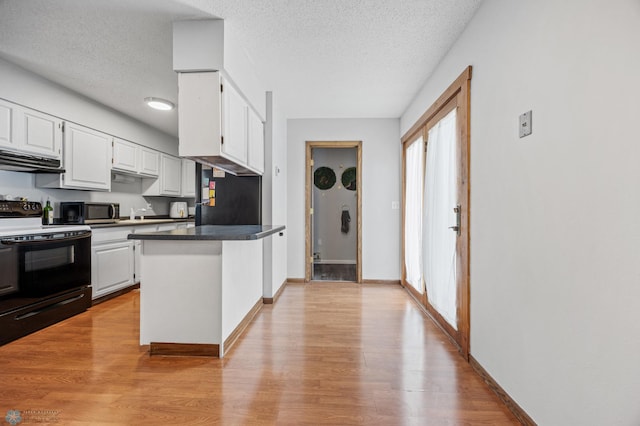 2350 20th Ave S, Fargo, ND 58103 - kitchen with white cabinetry, electric range, a peninsula, light wood-type flooring, and a textured ceiling