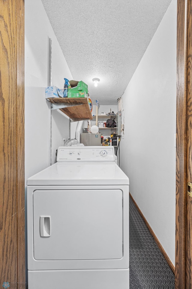 2350 20th Ave S, Fargo, ND 58103 - laundry room featuring washer / dryer, a textured ceiling, and carpet