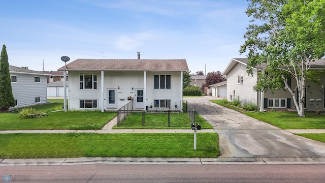 2350 20th Ave S, Fargo, ND 58103 - split foyer home with a front yard, a garage, and driveway