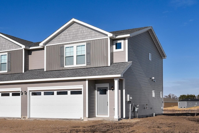 39743 Fallbrook Ave, North Branch, MN 55056 - view of front of home with an attached garage, dirt driveway, and a shingled roof