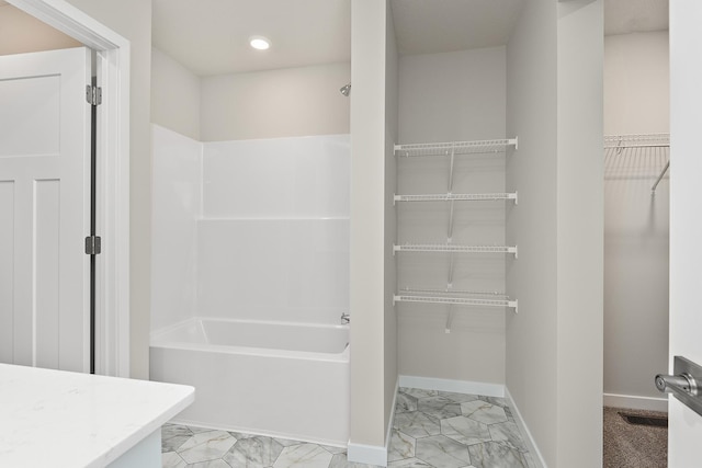 39743 Fallbrook Ave, North Branch, MN 55056 - full bathroom featuring bathing tub / shower combination, marble finish floors, a walk in closet, vanity, and recessed lighting
