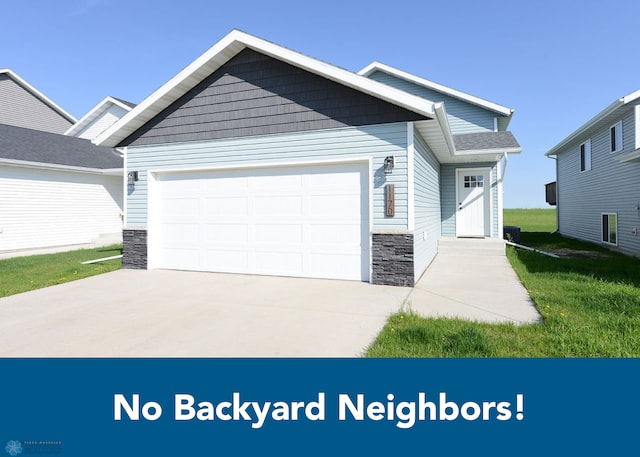 1170 Highland Ln W, West Fargo, ND 58078 - craftsman-style home with stone siding, a garage, and concrete driveway