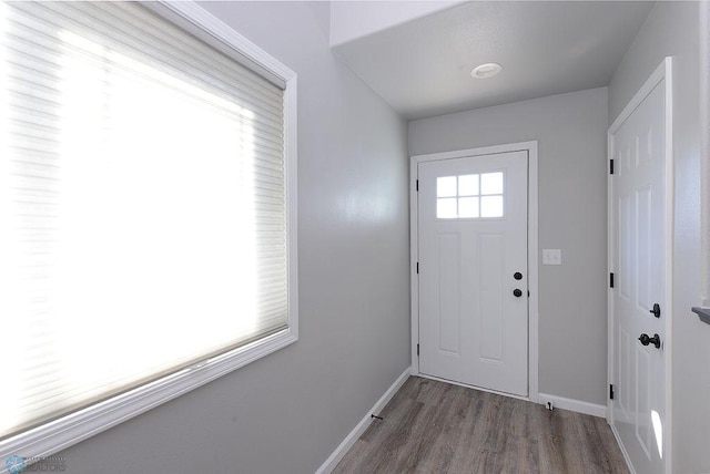 1170 Highland Ln W, West Fargo, ND 58078 - doorway to outside featuring wood finished floors and baseboards